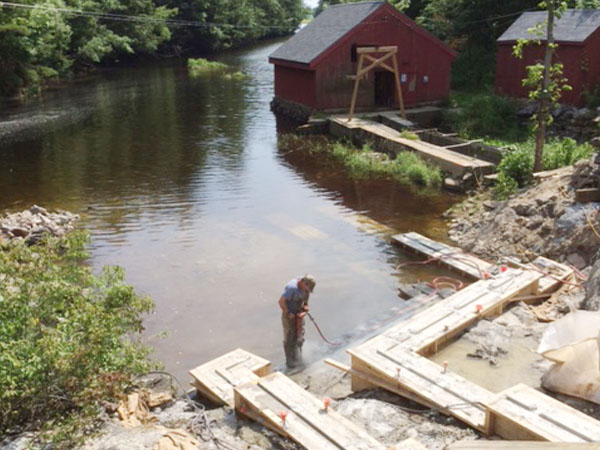 project required removal of old fish ladder and construction of new.